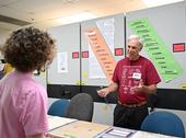 Bohart Museum associate Michael  Pitcairn, retired from the California Department of Food and Agriculture, answers questions about silkworm moths and textiles. (Photo by Kathy Keatley Garvey)